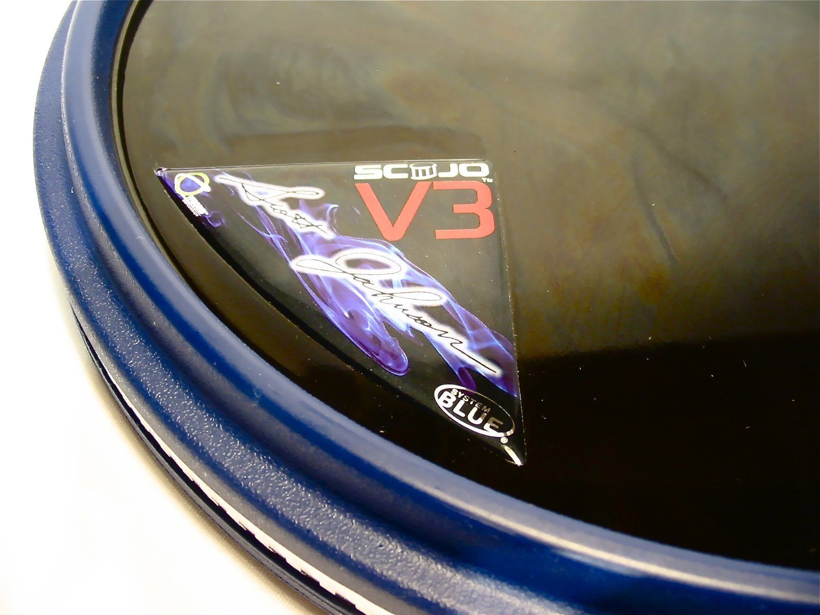 Offworld Invader V3 Scott Johnson blue practice pad — close-up of the Scott Johnson V3 logo and blue rim — Slide 4 of 5