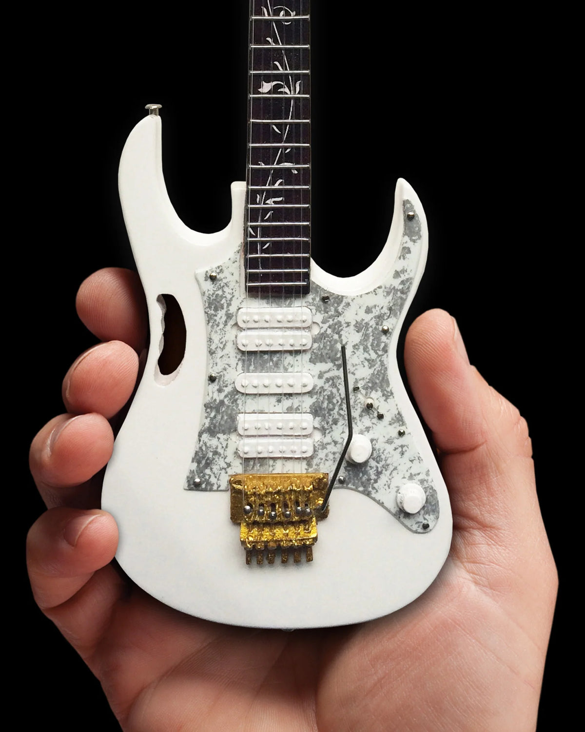 Hand-held view of the Steve Vai White JEM miniature guitar — Slide 6 of 6